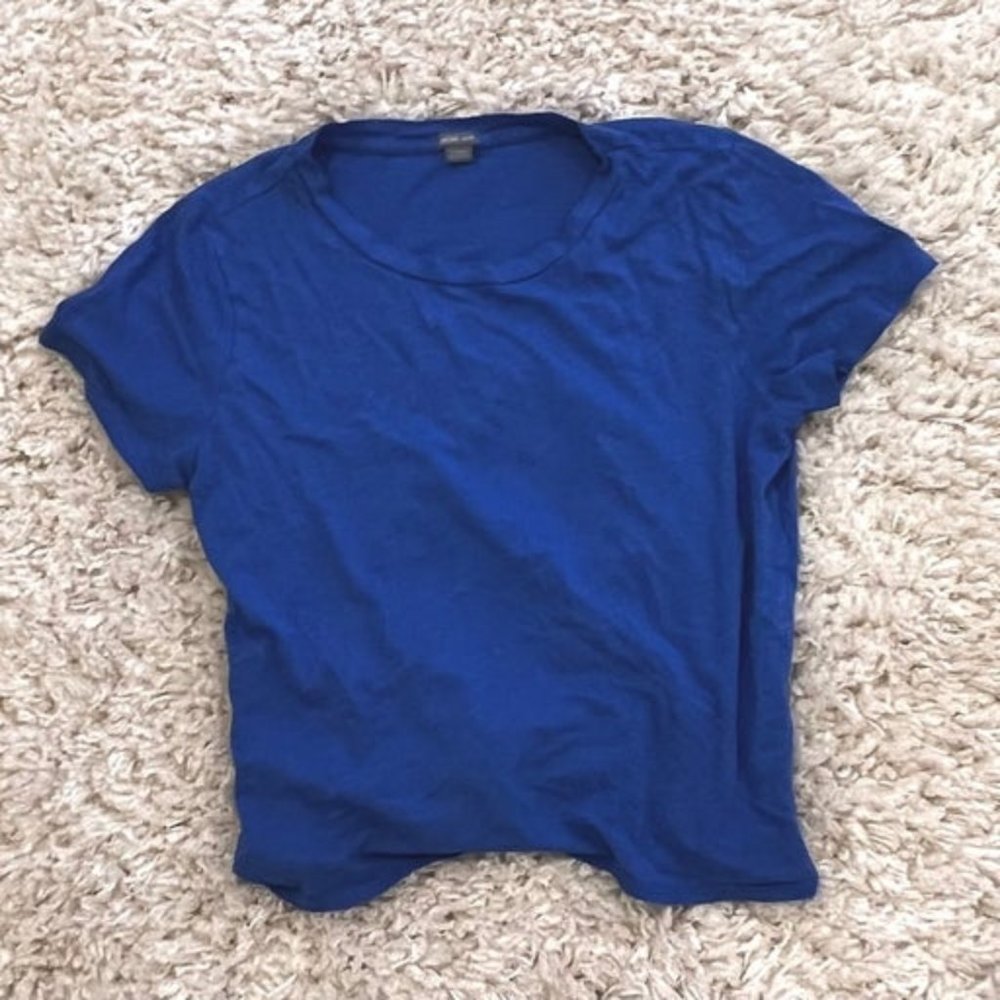 blue shirt with tie in the back
